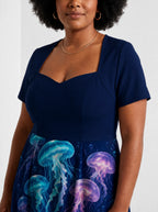"Bahari" Sweetheart Midi Dress — close-up of the sweetheart neckline on model