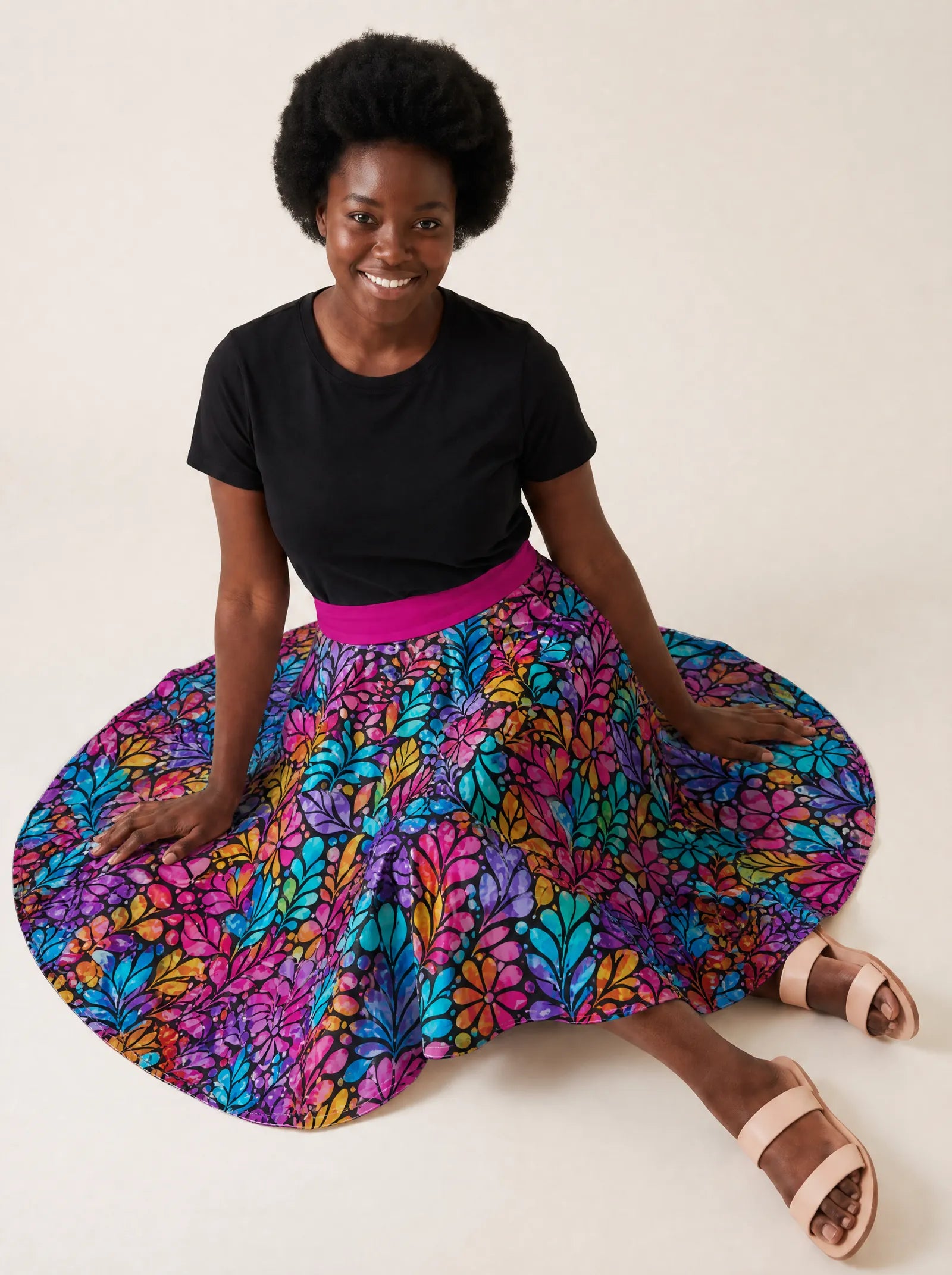 "Rangi" Twirl Skirt — seated on the floor with the skirt fanned out