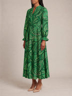 "Asili" Emerald Long Puff Sleeve Dress — three-quarter view on model