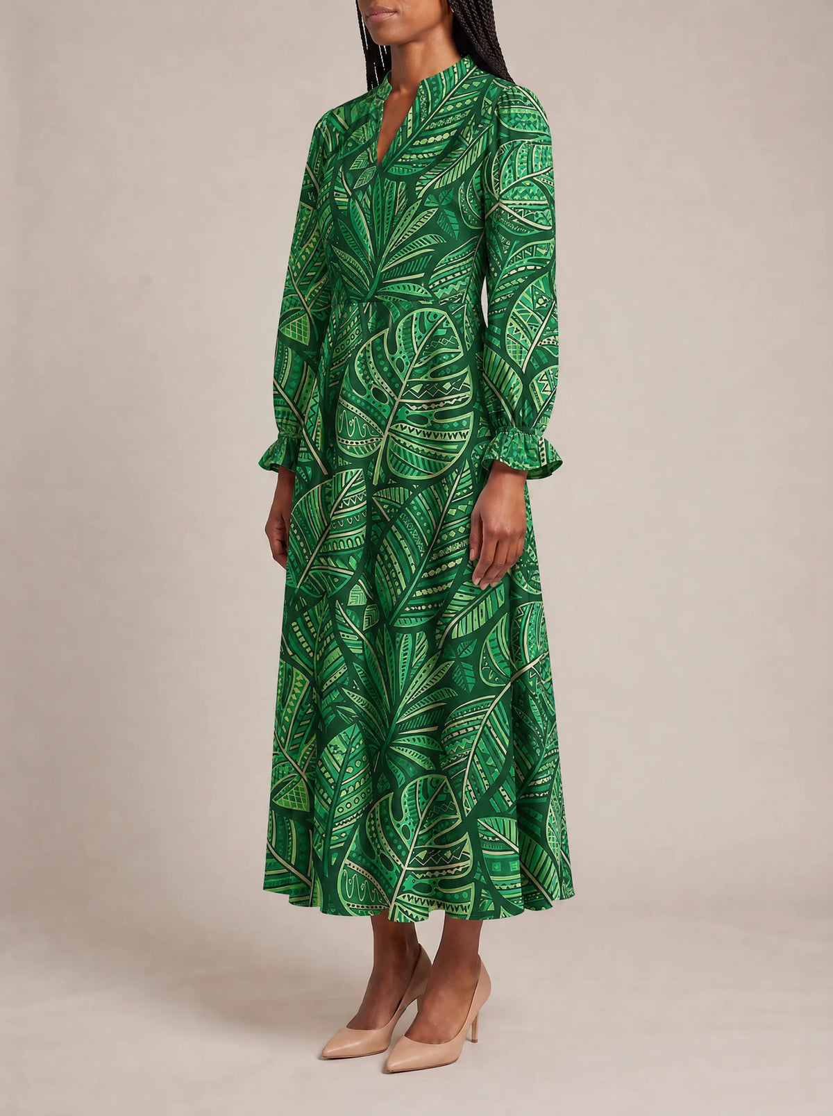 "Asili" Emerald Long Puff Sleeve Dress — three-quarter view on model