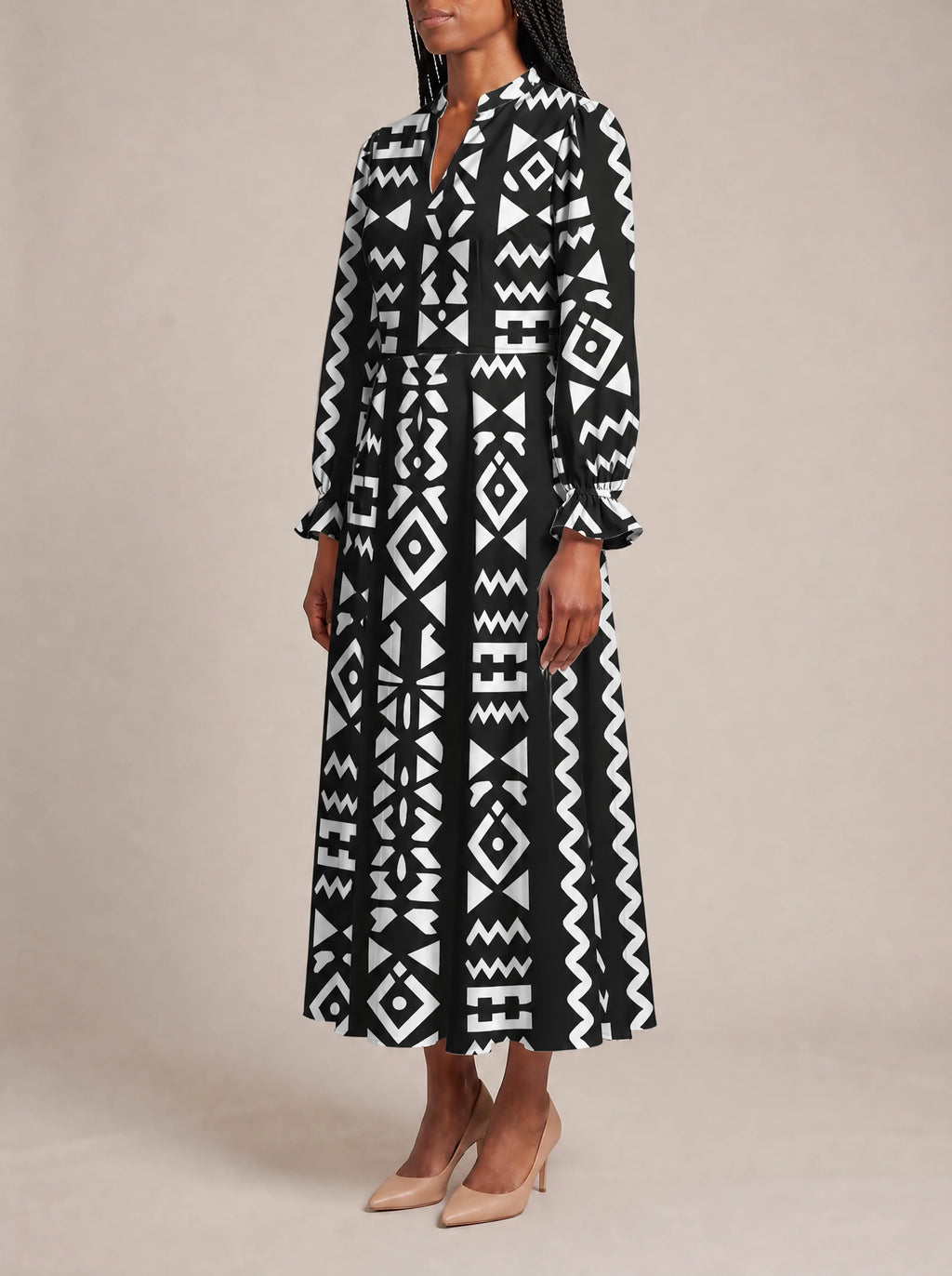 "Kuba" Long Puff Sleeve Dress — three-quarter view on model