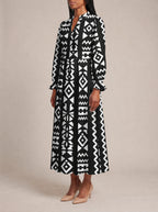 "Kuba" Long Puff Sleeve Dress — three-quarter view on model