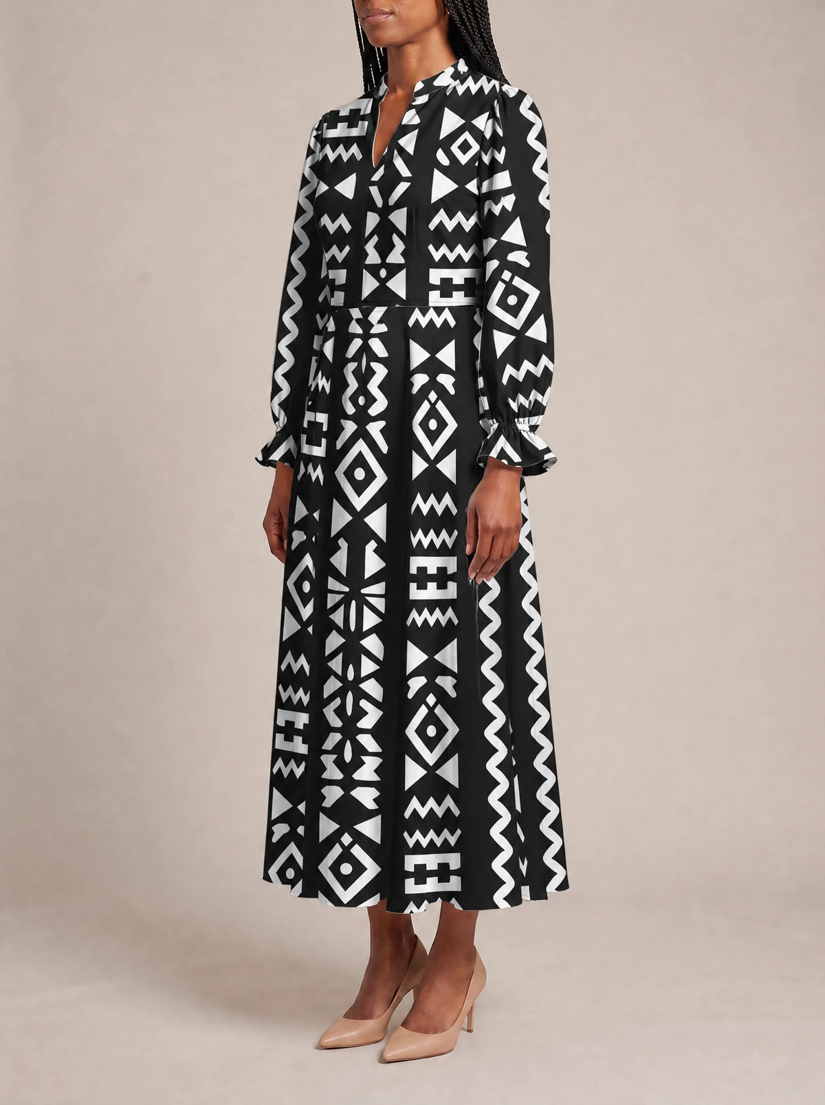 "Kuba" Long Puff Sleeve Dress — three-quarter view on model