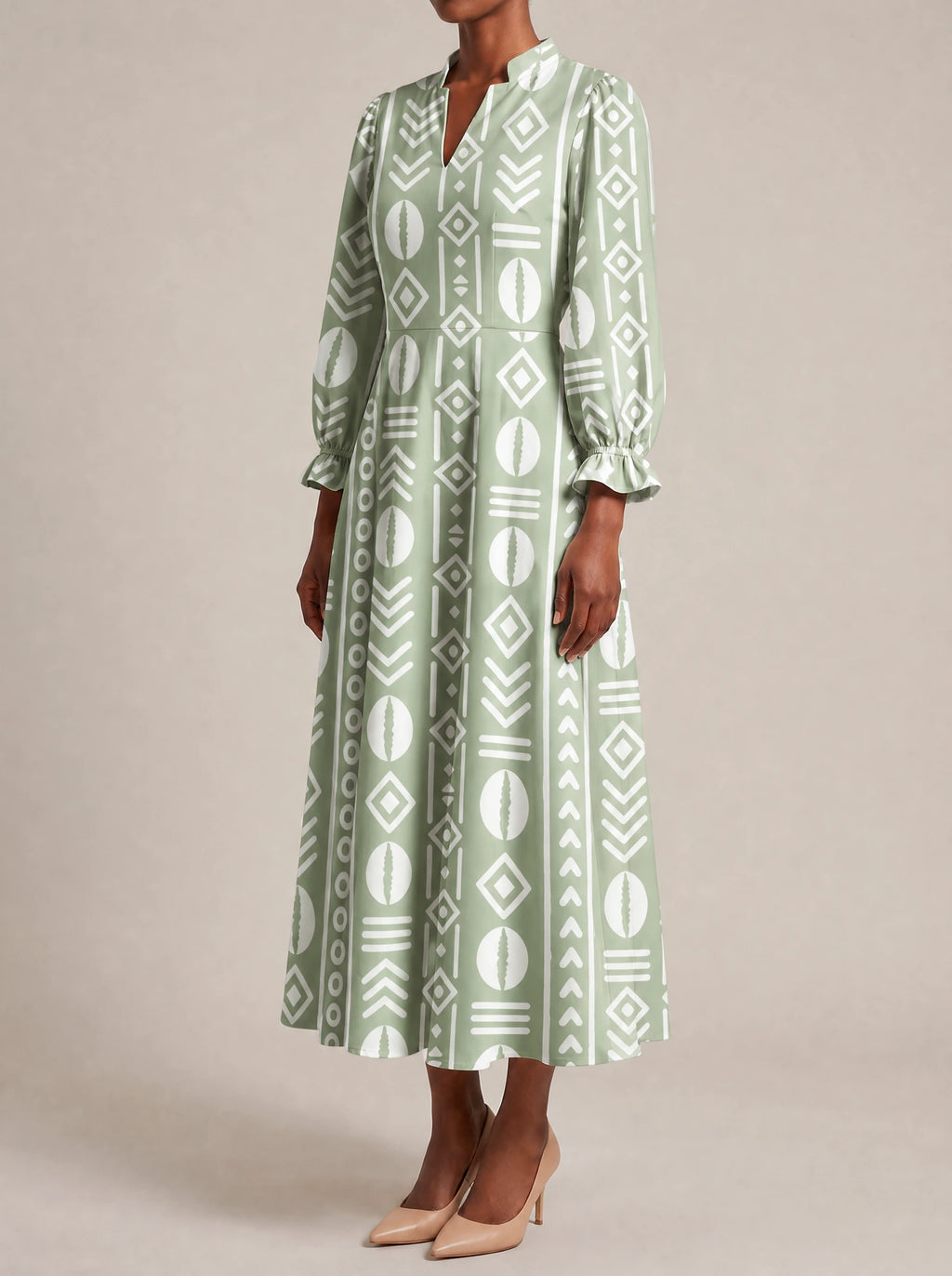 "Oshun Verde" Long Puff Sleeve Dress — three-quarter view on model