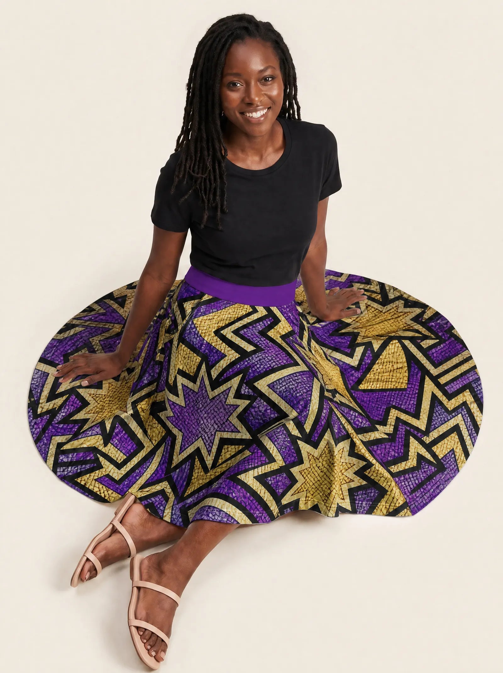 "Sheba" Twirl Skirt — seated on the floor with the skirt fanned out