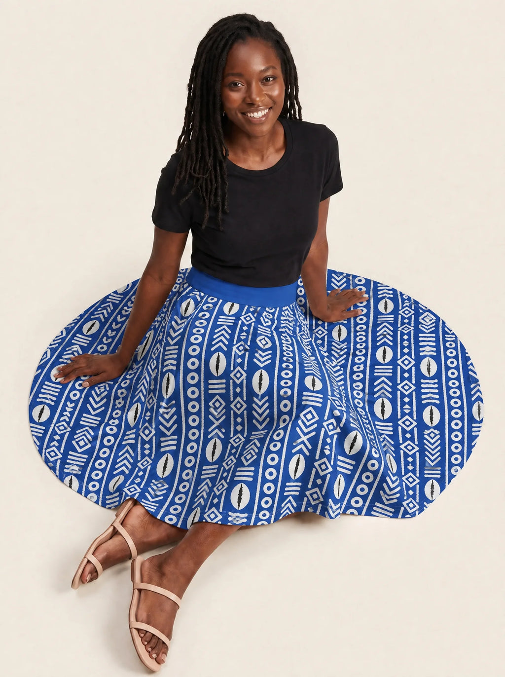 "Oshun Royal Blue" Twirl Skirt — seated on the floor with the skirt fanned out