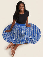 "Oshun Royal Blue" Twirl Skirt — seated on the floor with the skirt fanned out