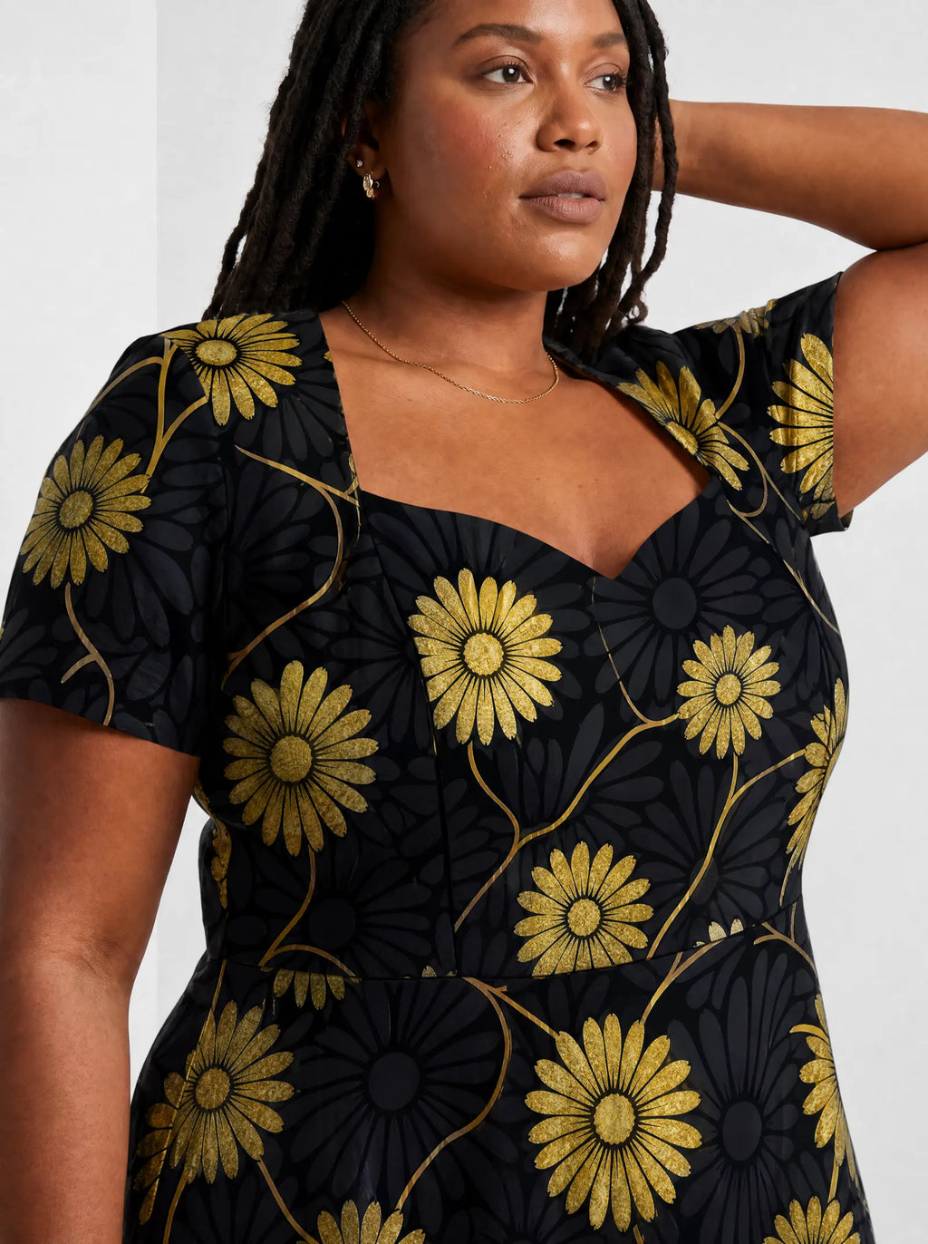 "Mulika" Sweetheart Midi Dress — close-up of the sweetheart neckline and short sleeve