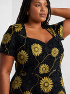 "Mulika" Sweetheart Midi Dress — close-up of the sweetheart neckline and short sleeve