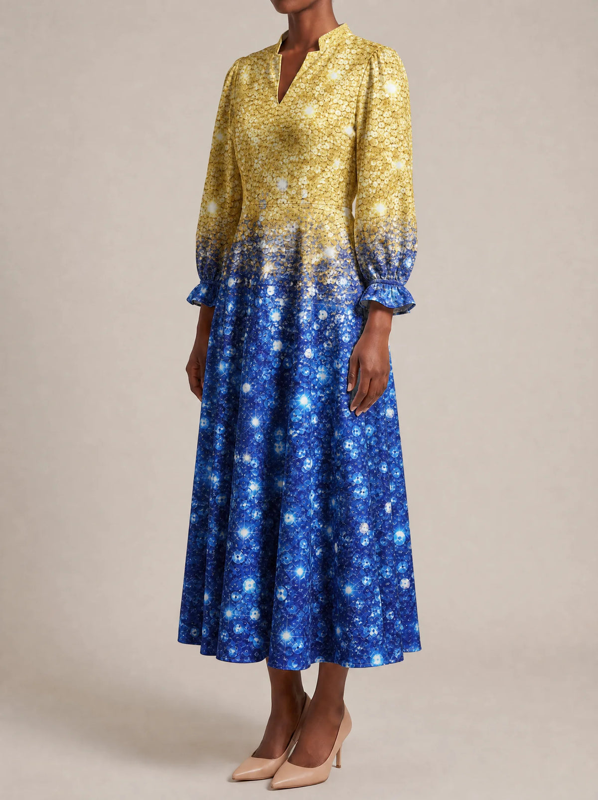 "Angaza" Long Puff Sleeve Dress — three-quarter view on model