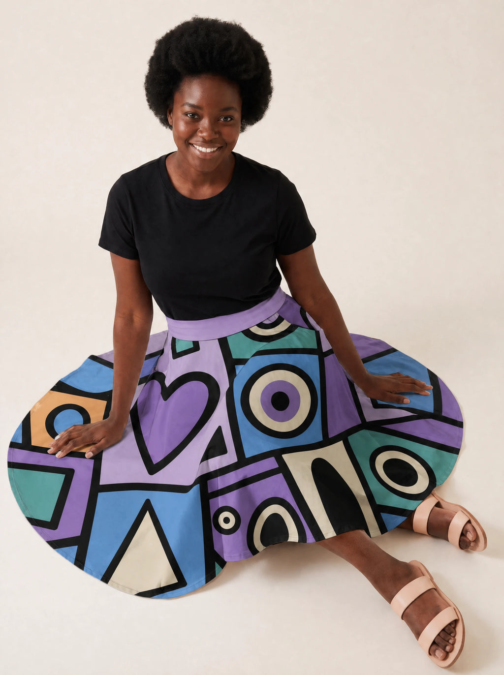 "Sanaa" Twirl Skirt — seated on the floor with the skirt fanned out