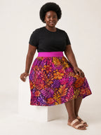 "Waridi" Twirl Skirt — seated on a studio cube