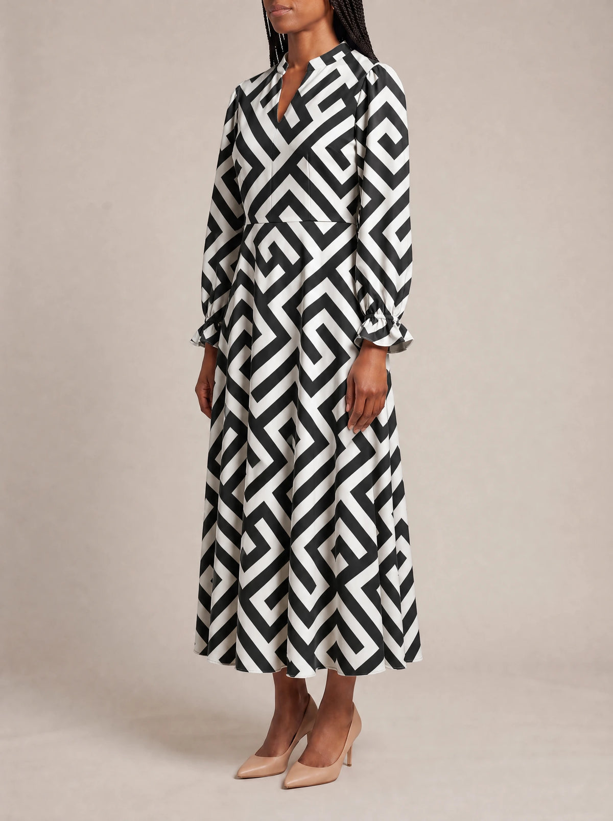 "Zamu" Long Puff Sleeve Dress — three-quarter view on model
