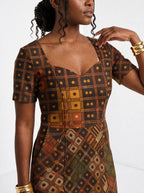 "Mkeka" Sweetheart Midi Dress — close-up of the sweetheart neckline and short sleeve