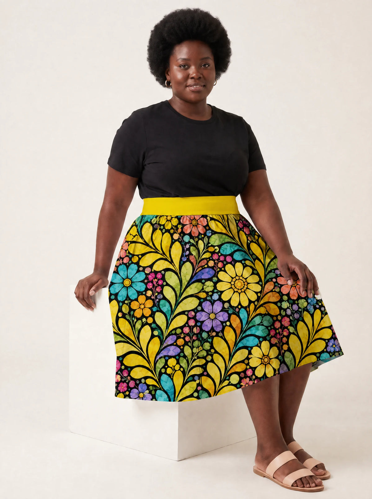 "Njano" Twirl Skirt — seated on model