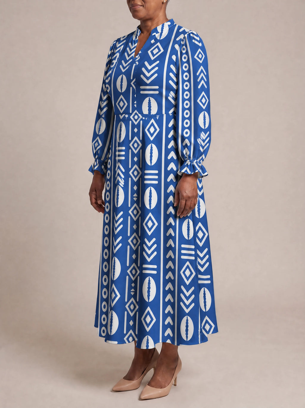 "Oshun" Royal Blue Long Puff Sleeve Dress — three-quarter view on model