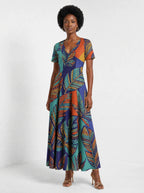 "Majani" Short Sleeve Maxi Dress — three-quarter view on model