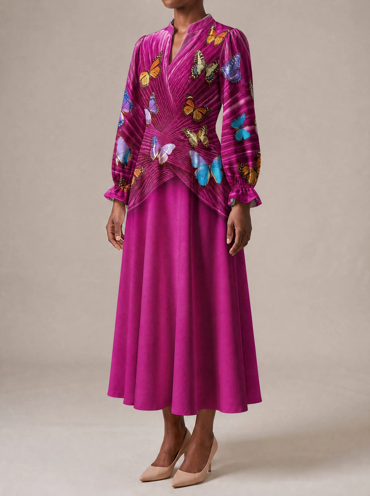 "Kipepeo" Long Puff Sleeve Dress — three-quarter view on model