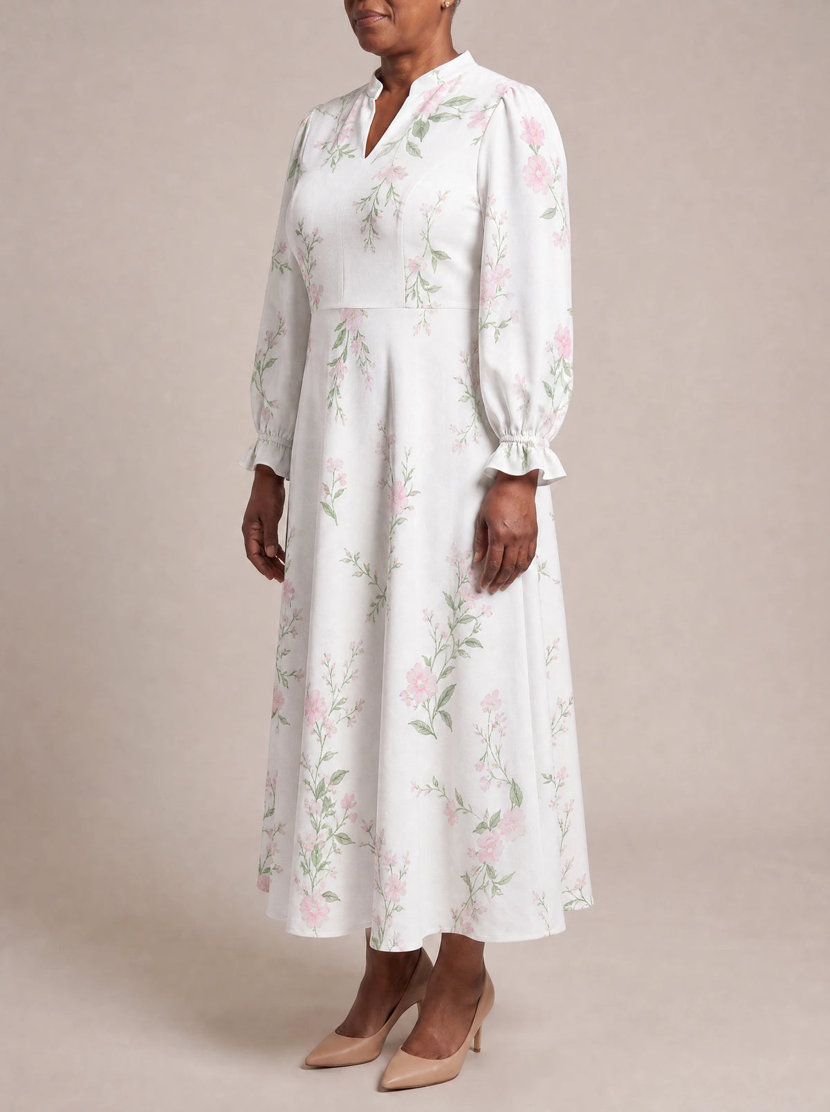 "Chanua" Long Puff Sleeve Dress — three-quarter view on model