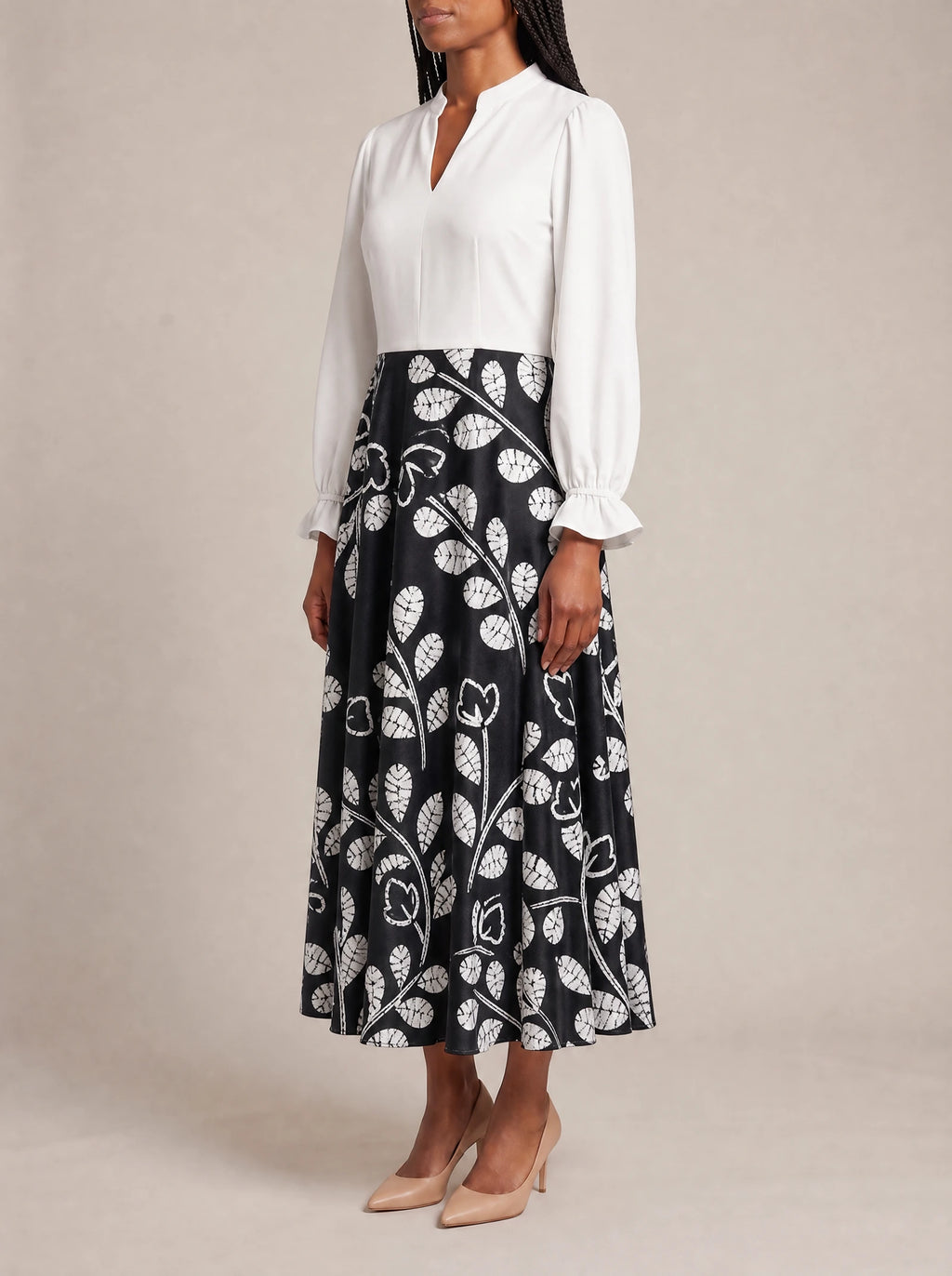 "Kivuli" Long Puff Sleeve Dress — three-quarter view on model