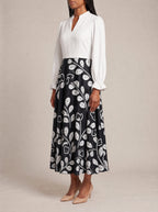 "Kivuli" Long Puff Sleeve Dress — three-quarter view on model