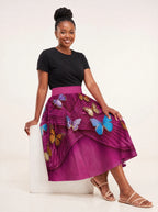 "Kipepeo" Twirl Skirt — seated on model