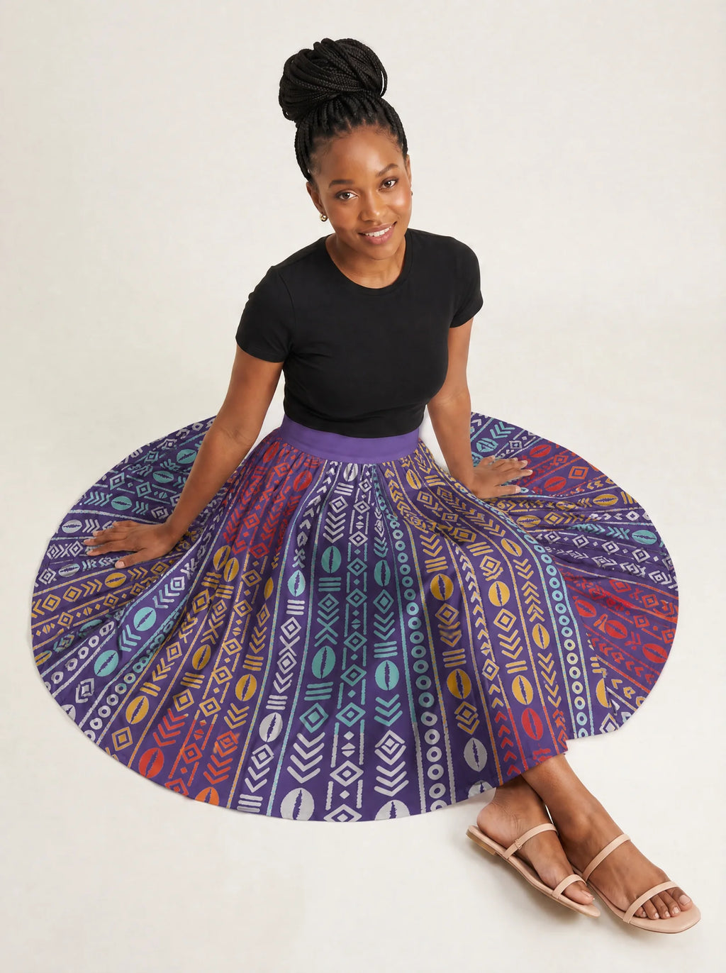 "Oshun Zamani" Twirl Skirt — seated on the floor with the skirt fanned out