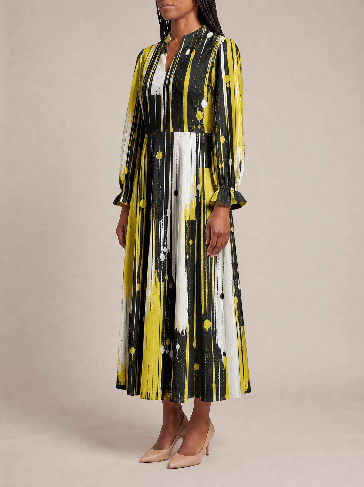 "Mvua" Long Puff Sleeve Dress — three-quarter view on model