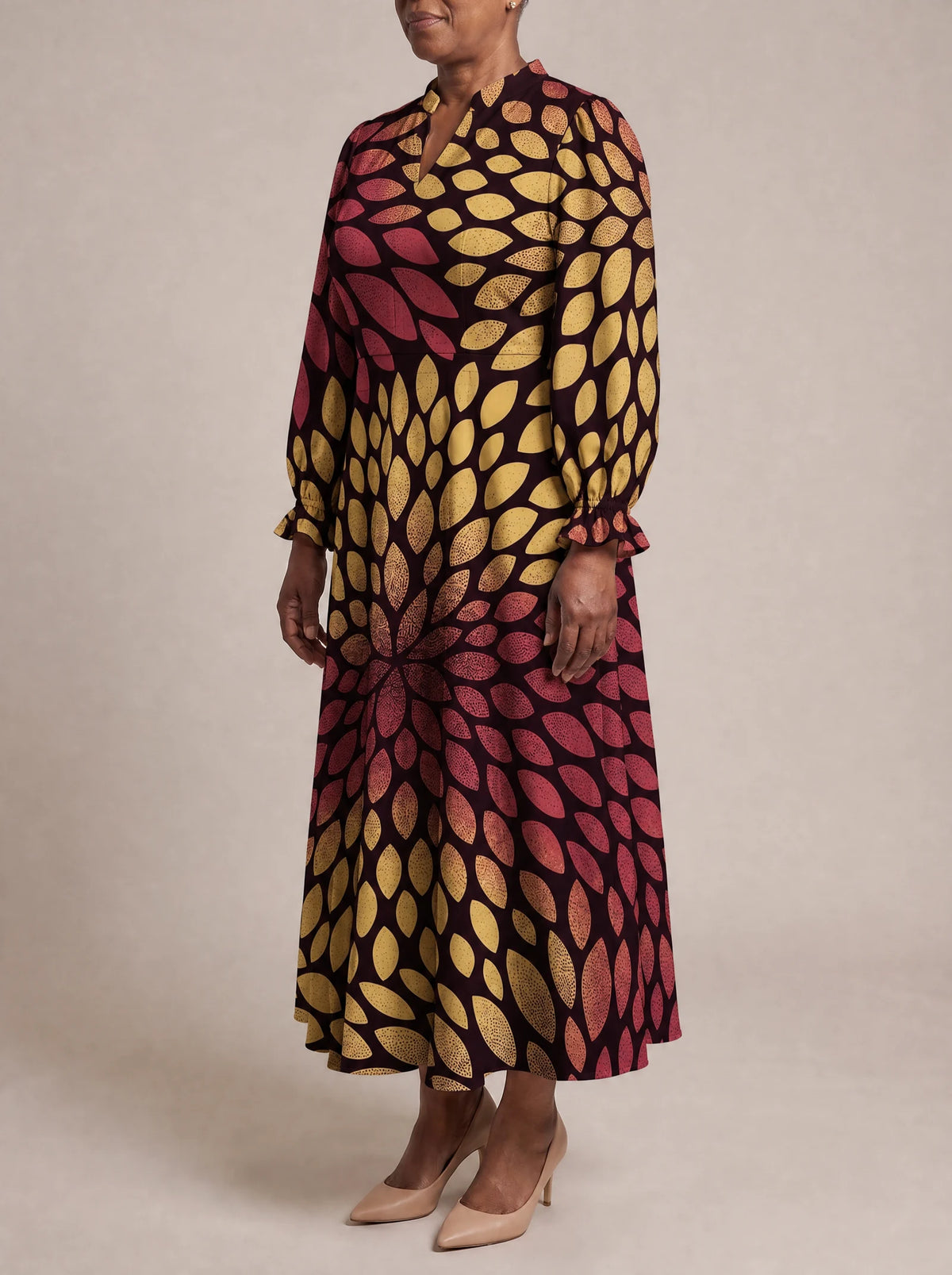 "Mavuno" Long Puff Sleeve Dress — three-quarter view on model