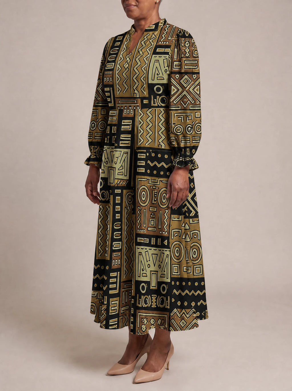 "Sankofa" Long Puff Sleeve Dress — three-quarter view on model