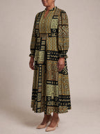 "Sankofa" Long Puff Sleeve Dress — three-quarter view on model