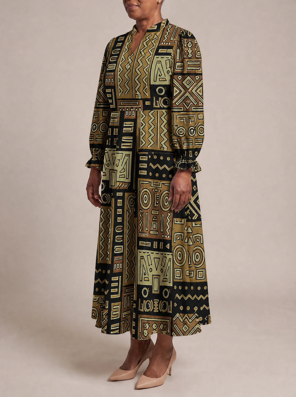 "Sankofa" Long Puff Sleeve Dress — three-quarter view on model