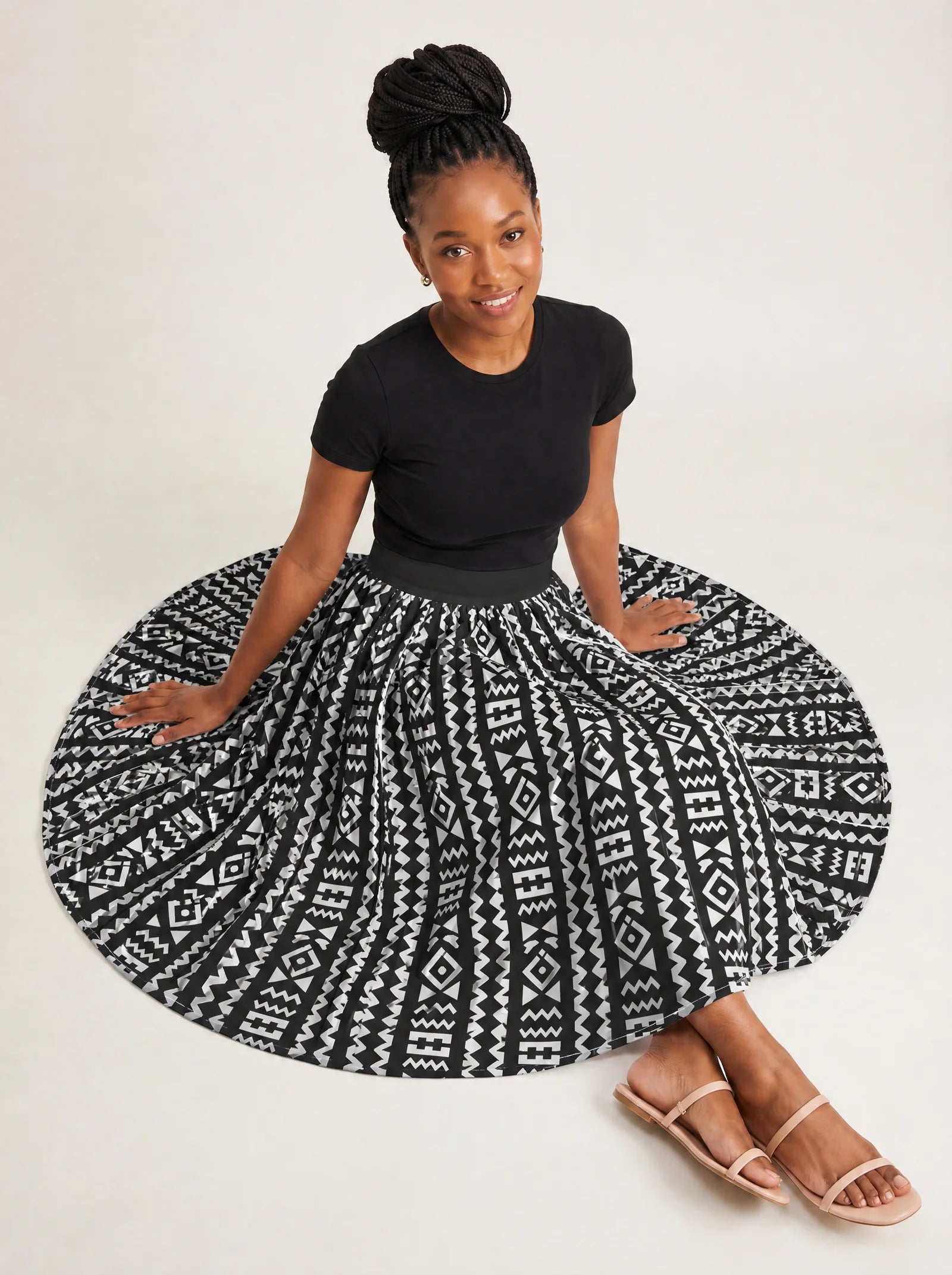 "Kuba" Twirl Skirt — seated on the floor with the skirt fanned out