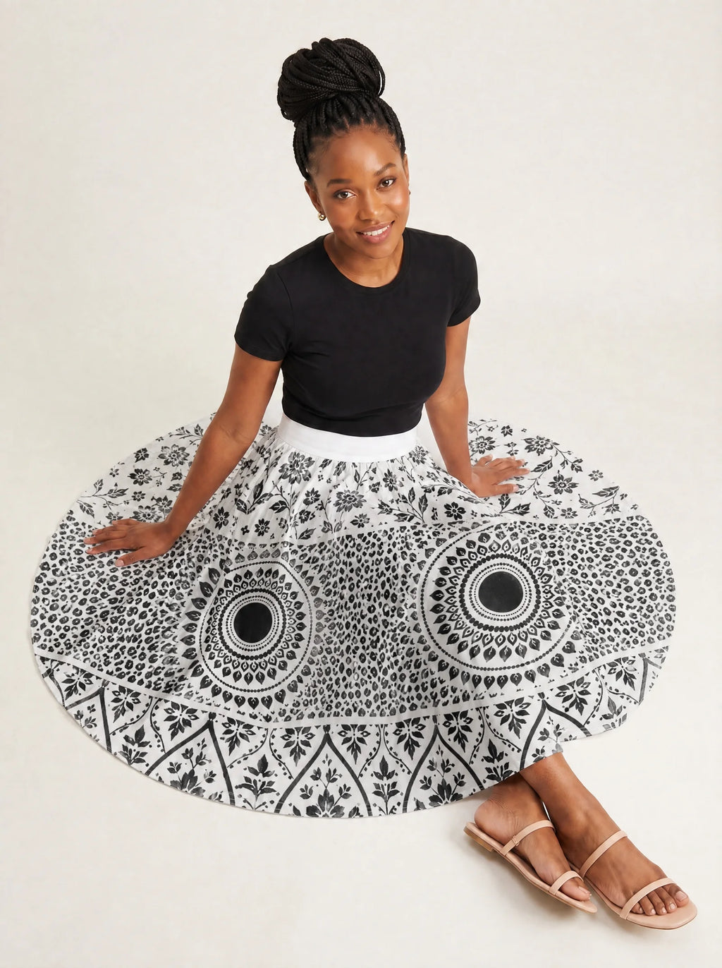"Mwanga" Twirl Skirt — seated on the floor with the skirt fanned out