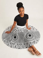 "Mwanga" Twirl Skirt — seated on the floor with the skirt fanned out