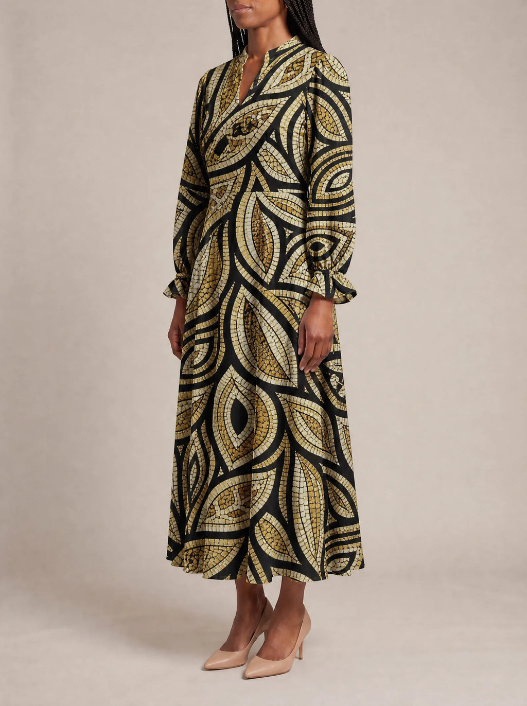 "Ashanti" Long Puff Sleeve Dress — three-quarter view on model