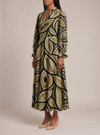 "Ashanti" Long Puff Sleeve Dress — three-quarter view on model
