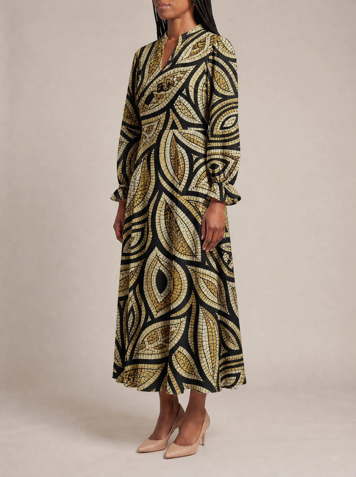 "Ashanti" Long Puff Sleeve Dress — three-quarter view on model