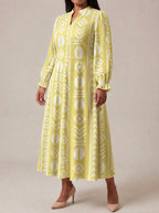 "Oshun Dhahabu" Long Puff Sleeve Dress — three-quarter view on model