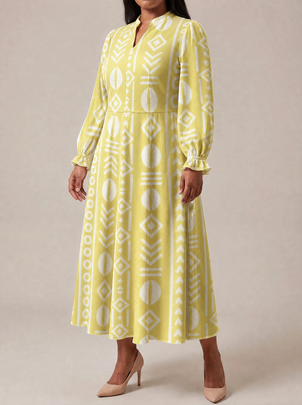 "Oshun Dhahabu" Long Puff Sleeve Dress — three-quarter view on model