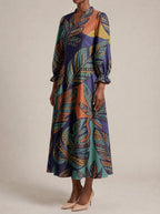 "Majani" Long Puff Sleeve Dress — three-quarter view on model