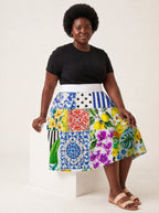 "Kisiwa" Twirl Skirt — seated on model