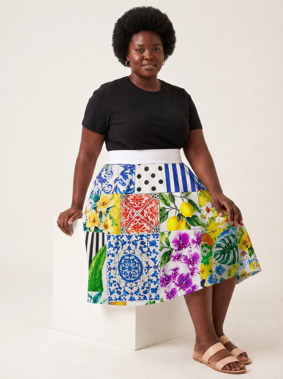 "Kisiwa" Twirl Skirt — seated on model