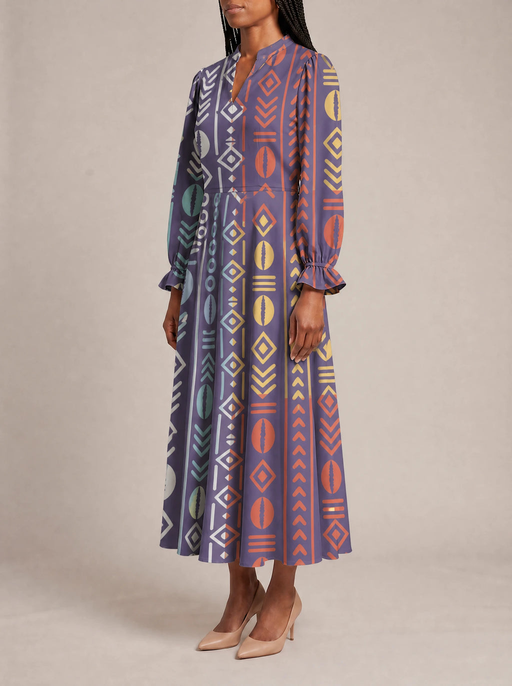 "Oshun Zamani" Long Puff Sleeve Dress — three-quarter view on model