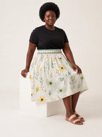 "Alizeti" Twirl Skirt — seated on a studio cube