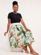 "Ndege" Twirl Skirt — seated on a studio cube