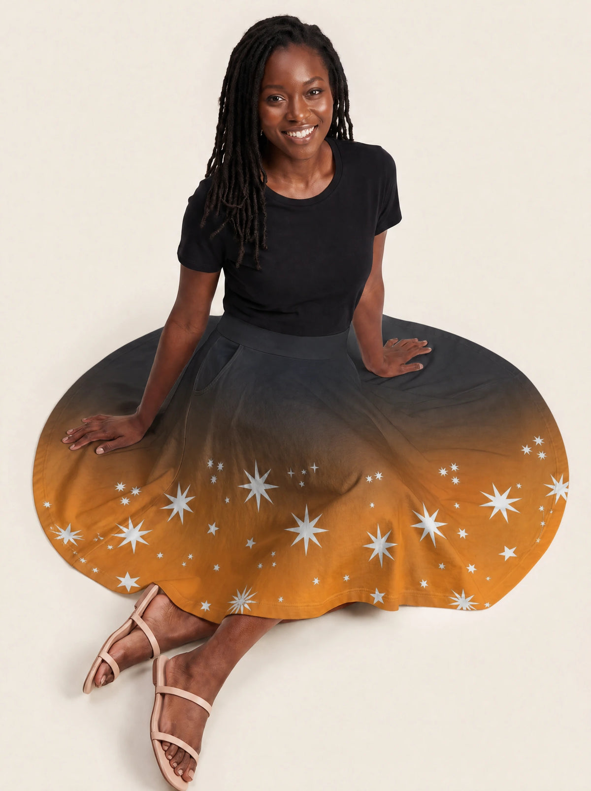 "Nuru" Twirl Skirt — seated on model