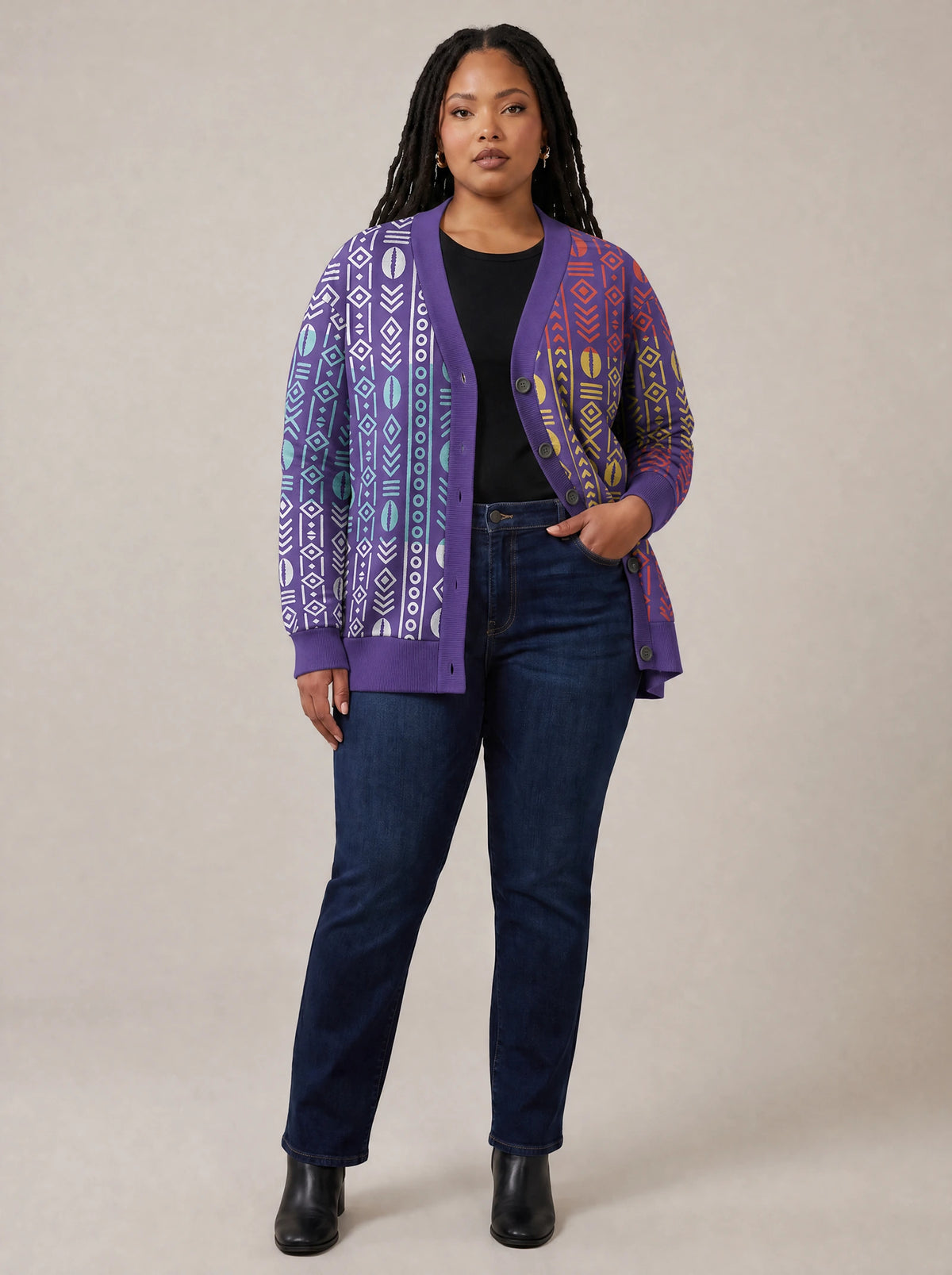 "Oshun Zamani" Cardigan — on model with hands in her jeans pockets
