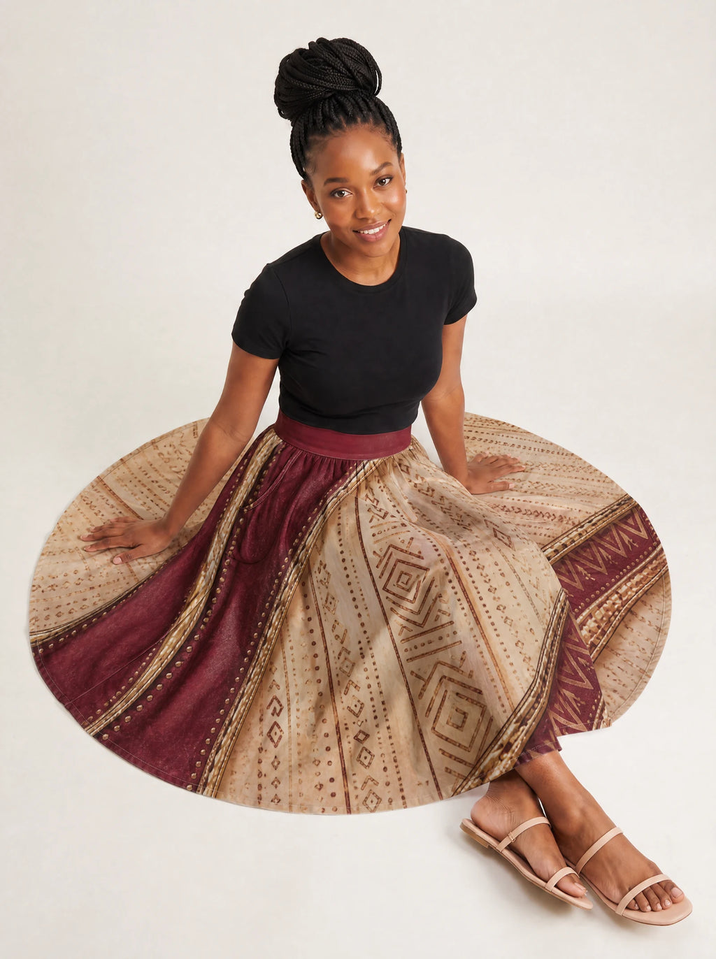 "Tapa" Twirl Skirt — seated on model
