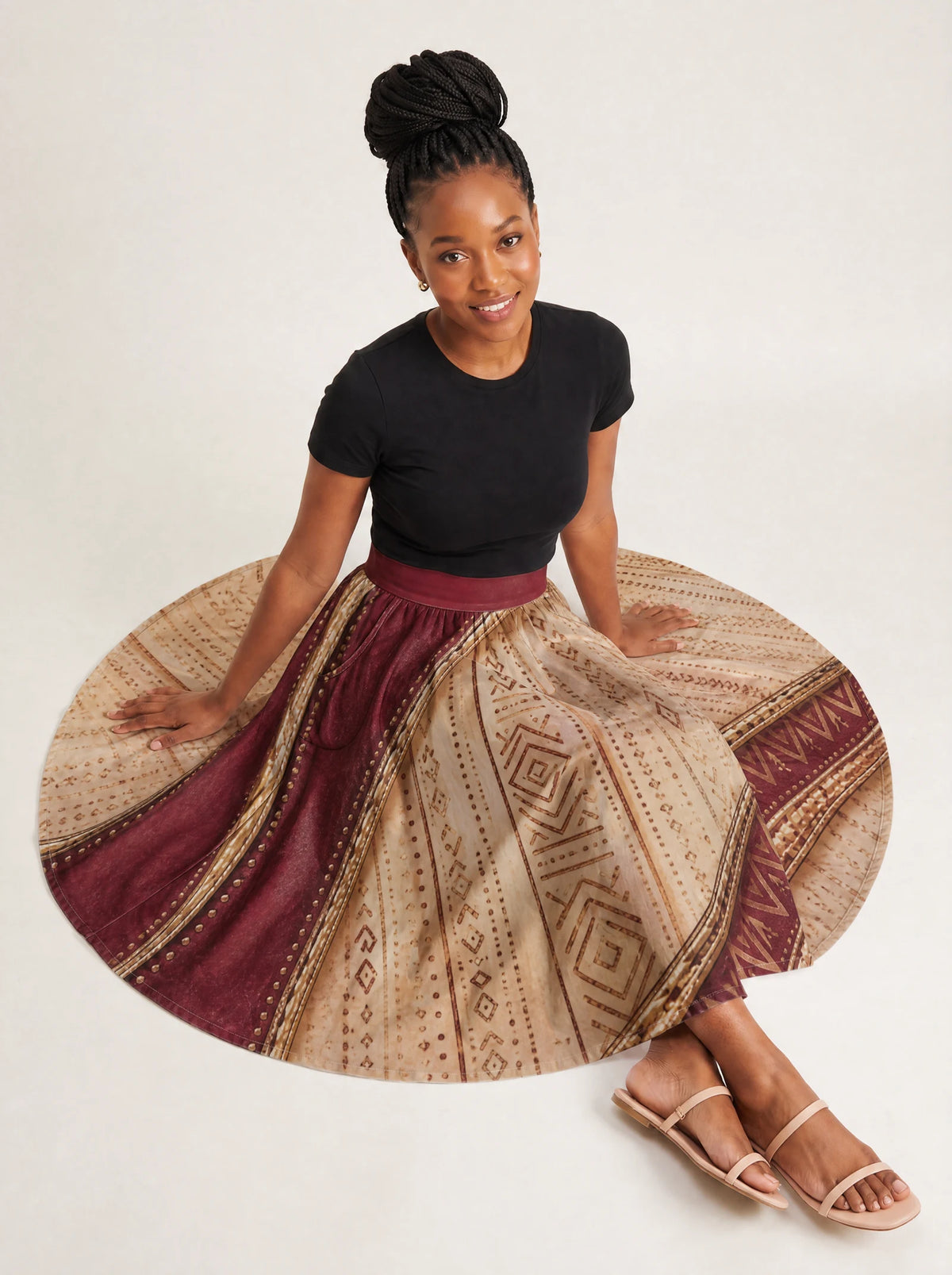 "Tapa" Twirl Skirt — seated on model